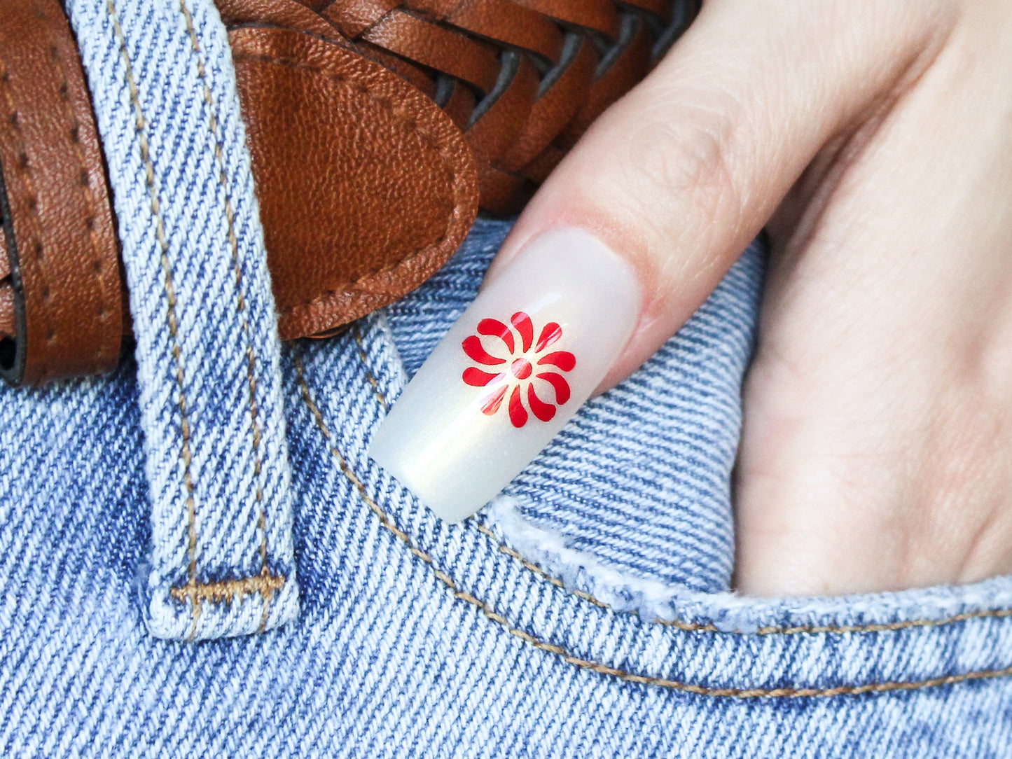 This image features a single red Talavera nail sticker showcasing a traditional decorative pattern.